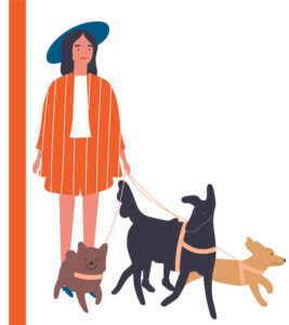 Cool trendy woman with a hat walking her cool dogs.