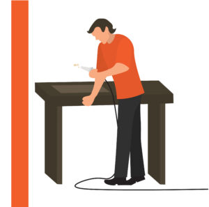 Graphic of man by a table coating a metal sheet